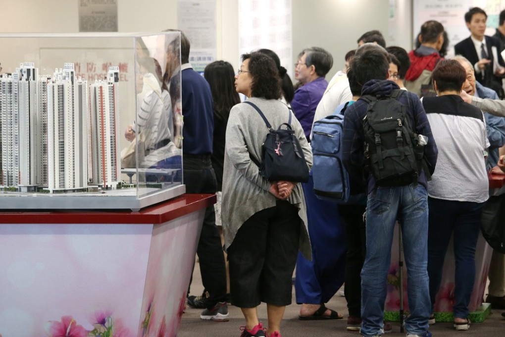 People queue up to hand in applications for the sale of Housing Authority flats at Kai Long Court in Kai Tak. Photo: David Wong