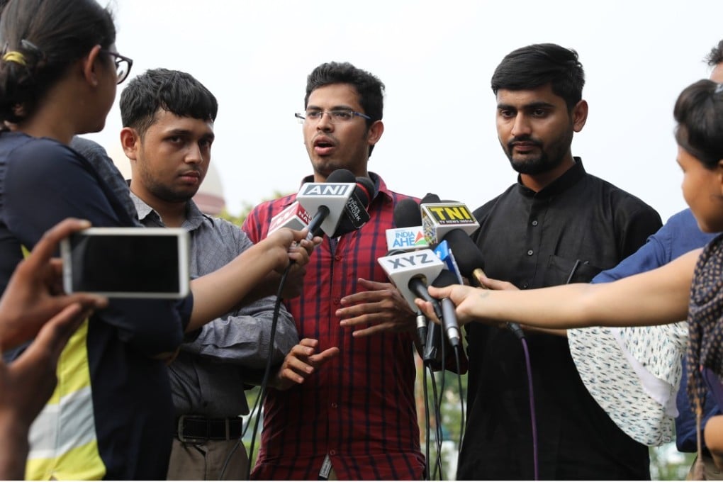 Indian petitioners and LGBT activists Romel Barel, left, Krishna Reddy, centre, and Anwesh Pokkuluri talk to the media after a hearing at the Supreme Court in New Delhi. Photo: EPA