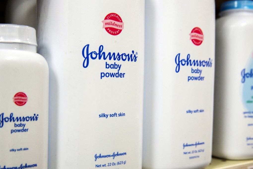 Containers of Johnson & Johnson baby powder on a chemist’s shelf. Photo: Reuters