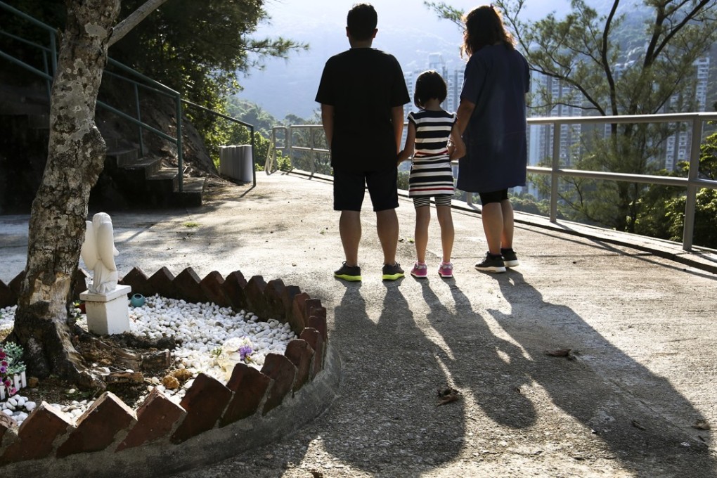 Maggie and her husband Jerry with their daughter Jane. The family lost a child in a miscarriage. Photo: Edmond So