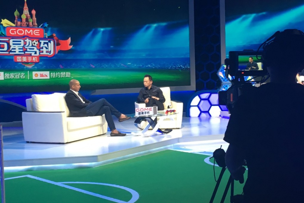 Ex-France striker David Trezeguet talks to Su Dong in the Tencent studio. Photo: Michael Church