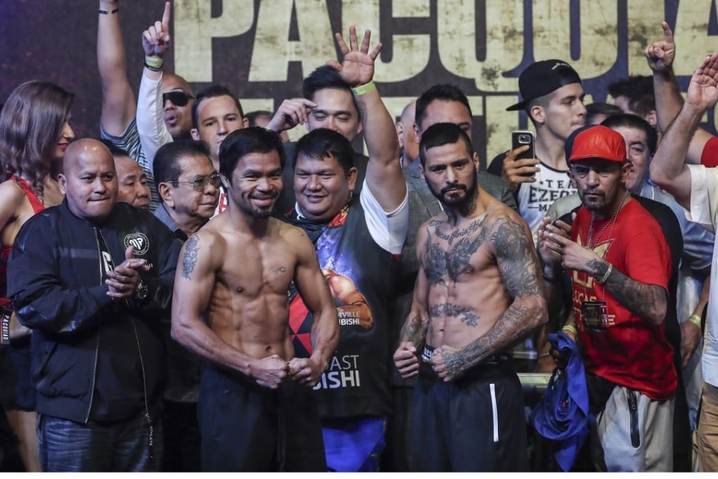 Filipino senator and boxing icon Manny Pacquiao and Argentina’s Lucas Matthysse pose at the weigh-in in Kuala Lumpur. Photo: EPA