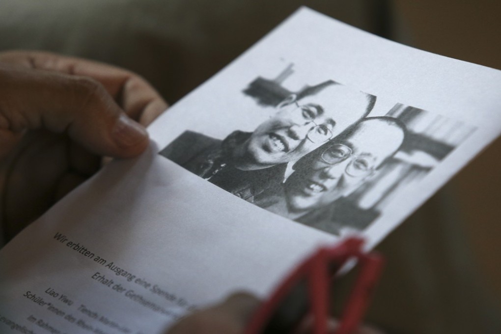 An order of service with a picture of Liu Xiaobo and Liu Xia on the cover. Photo: Sam Tsang