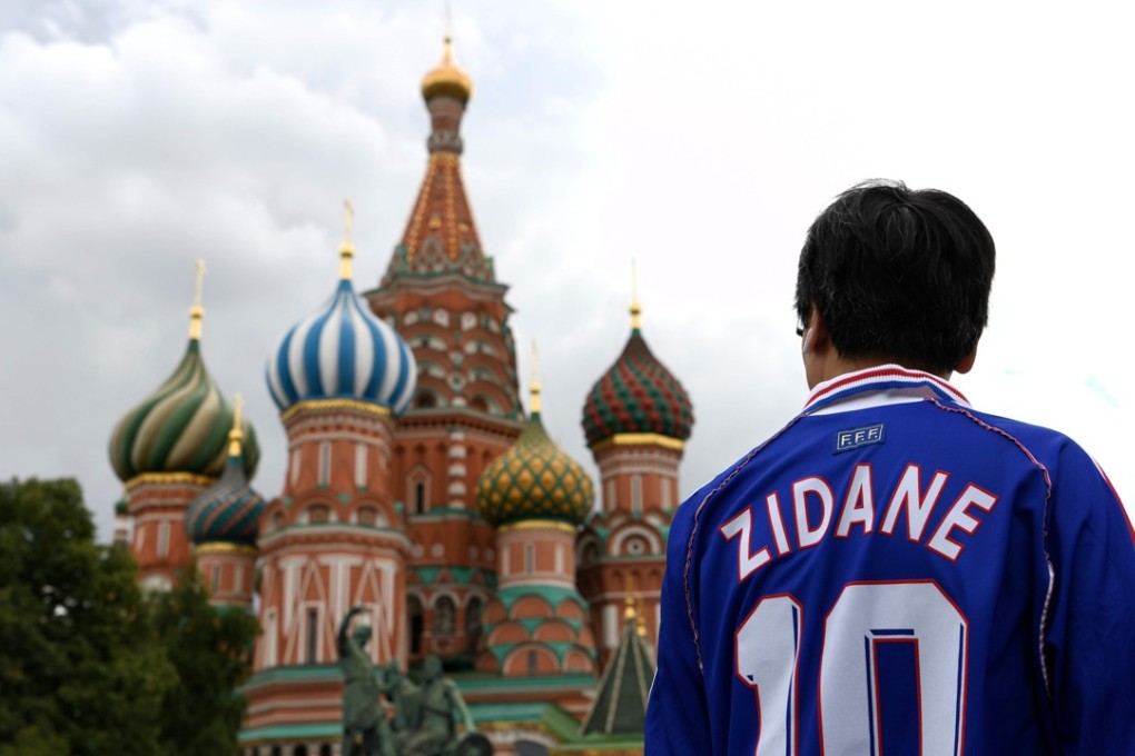 Alex Li from China wearing Zinedine Zidane’s jersey visits Red Square in Moscow, two days before the 2018 World Cup final between France and Croatia. Photo: AFP