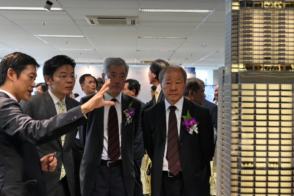 Lawrence Wong, second from left, the national development minister, with developers. Photo: AFP