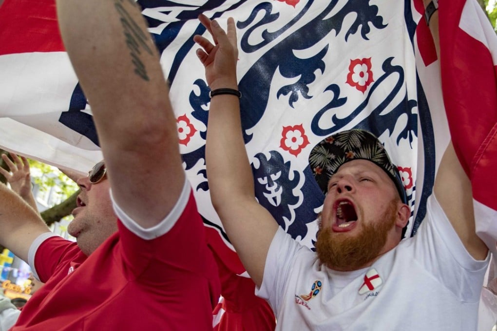 England fans celebrate their team winning after watching the quarter-final against Sweden. Photo: EPA