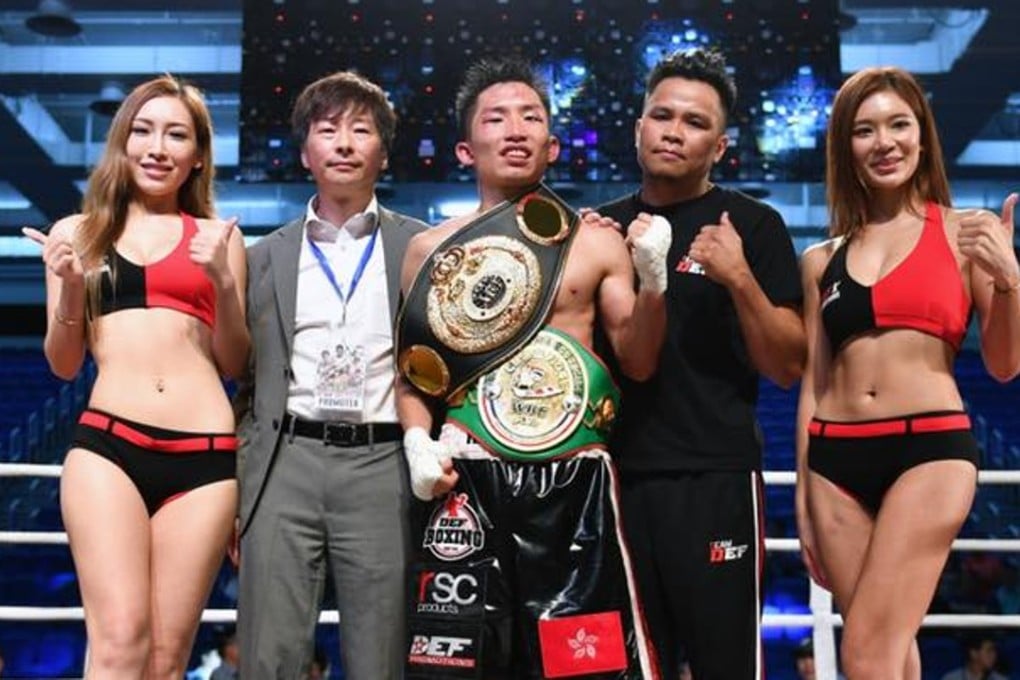 Poon soaks in the win alongside Def chief Jay Lau. Photos: Handout