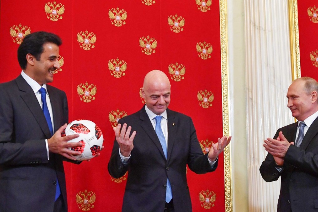 Qatar Emir Sheikh Tamim bin Hamad al-Thani, Fifa president Gianni Infantino and Russian president Vladimir Putin attend a handover ceremony for the 2022 World Cup. Photo: Reuters