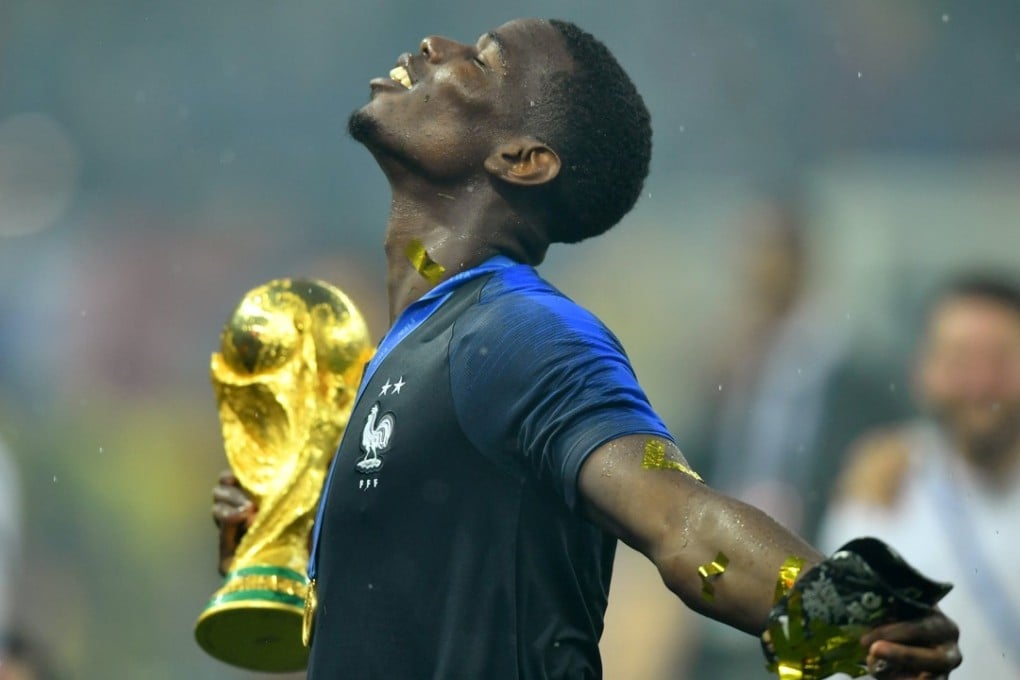 France’s Paul Pogba holds the World Cup trophy as he celebrates. Photo: Reuters