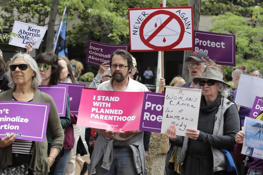 Protesters at a demonstration against US President Donald Trump and his choice of conservative Brett Kavanaugh – a federal appeals court judge – as his second nominee to the Supreme Court, in Seattle on July 10. Kavanaugh faces debate over his stance on abortion rights, executive power and other legal issues that could reshape the court and roil the midterm elections. Photo: AP s
