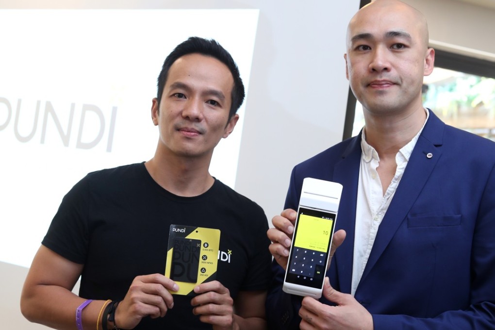 Larry Tang (left), founder of FAMA Group, and Zac Cheah, co-founder and CEO of Pundi X, at the launch of Pundi X’s cryptocurrency point-of-sales device, in Sheung Wan, on Tuesday. Photo: Winson Wong