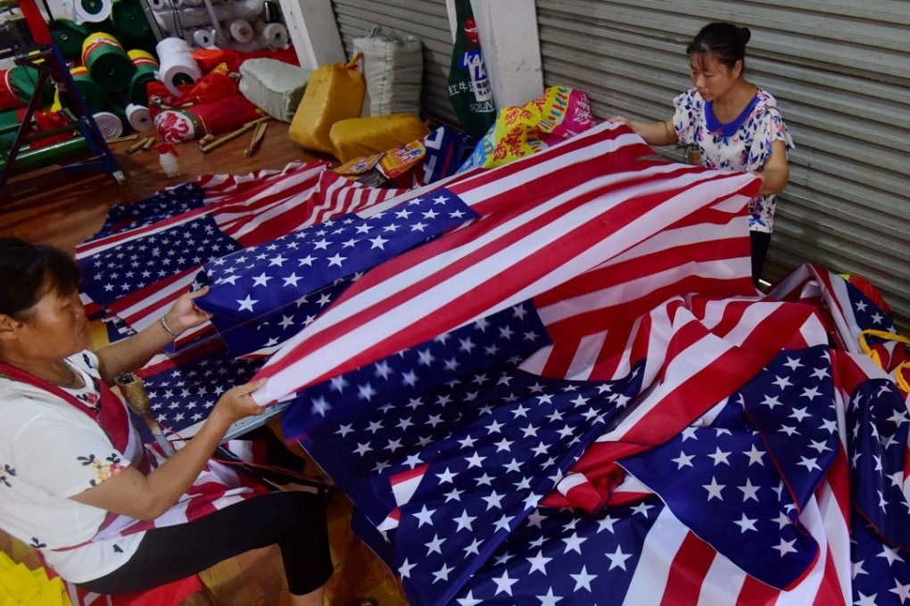 Workers sew US flags at a factory in eastern China. Beijing has reacted swiftly to Donald Trump’s latest tariff plan amid deepening concern about the economic impact of their dispute. Photo: AFP