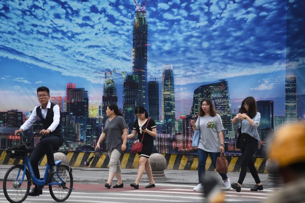Pedestrians in Beijing’s central business district. A full-blown trade war could sink China’s markets even deeper into bear territory, hitting financial wealth expectations and consumer confidence hard. China’s policy planners must work doubly hard to make up for the shortfall in demand. Photo: AFP