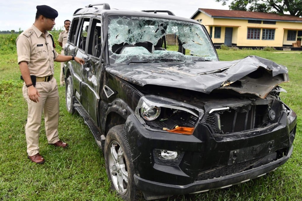 Police looking at a damaged vehicle in which two men were lynched Karbi Anglong district, some 180km from Guwahati, the capital city of India’s northeastern state of Assam. Smartphone footage shows the two blood-soaked men pleading for their lives. Moments later they were dead, two more victims of lynchings sparked by rumours spread on Facebook and WhatsApp in India. Photo: AFP