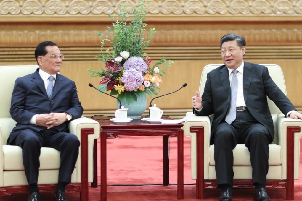 Chinese President Xi Jinping (right) meets a delegation of people from various sectors in Taiwan, led by former chairman of the Kuomintang party Lien Chan (left), at the Great Hall of the People in Beijing on Friday. Photo: Xinhua