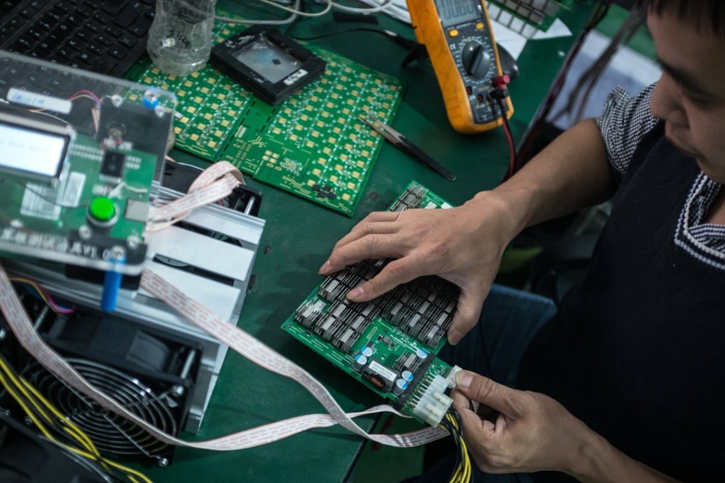 A researcher works in a laboratory at Bitmain Technology’s manufacturing base in Shenzhen. Bitmain, the world’s biggest supplier of cryptocurrency mining equipment and China’s largest bitcoin miner, has invested an undisclosed amount in Hong Kong-based Block.one, the software company behind the EOSIO blockchain protocol. Photo: EPA