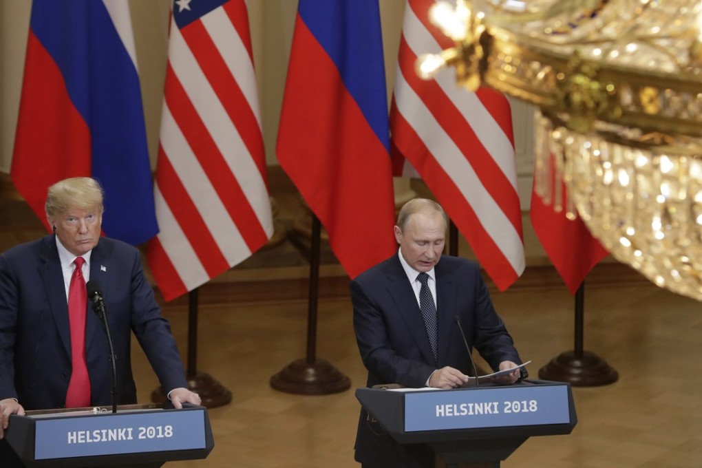 US President Donald Trump, left, listens to his Russian counterpart Vladimir Putin during a press conference after their meeting in Helsinki on July 16. Photo: AP