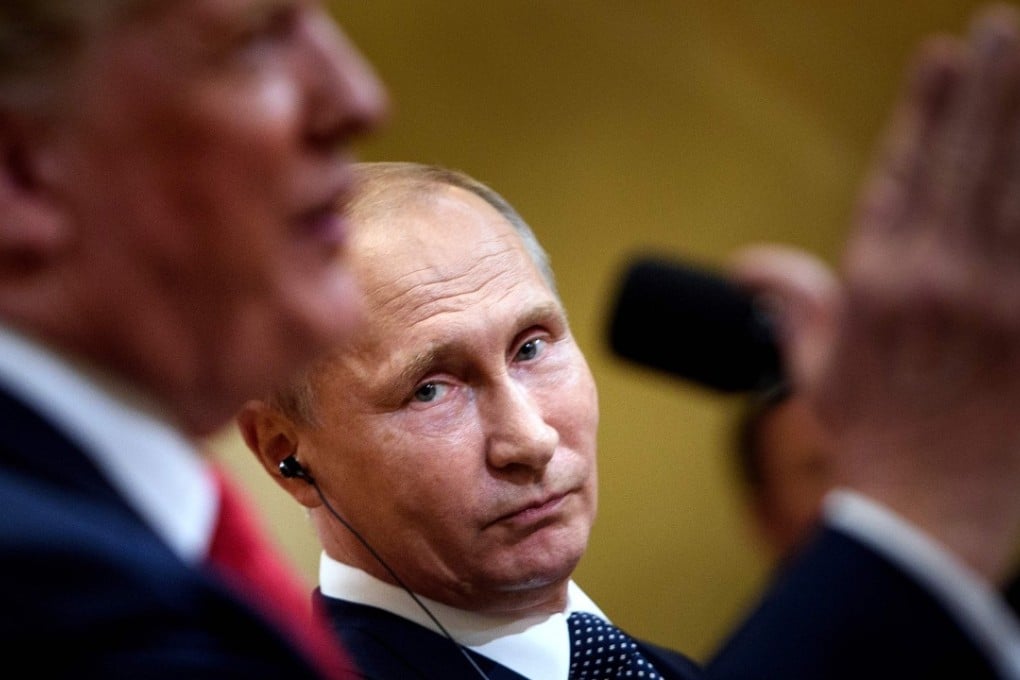 Russia's President Vladimir Putin listens while US President Donald Trump speaks during a press conference at Finland's Presidential Palace in Helsinki on Monday. Photo: Agence France-Presse