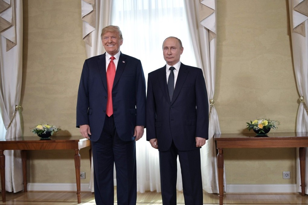US President Donald Trump (left) and Russia's President Vladimir Putin pose ahead their meeting in Helsinki, on Monday. Photo: Agence France-Presse