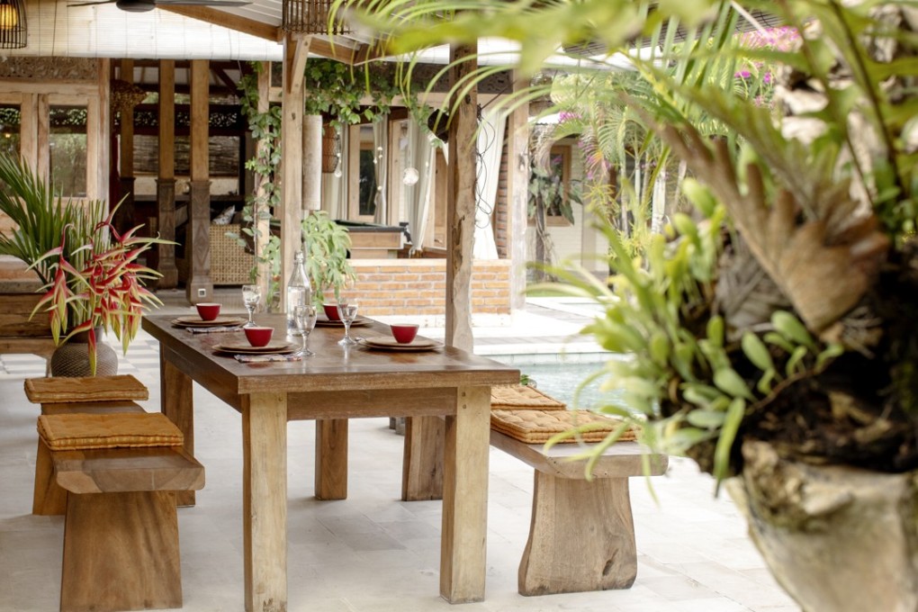 Bali’s climate invites indoor-outdoor living, which Liina Klauss and her family enjoy at the al fresco dining table. Photography: Anthony Dodds