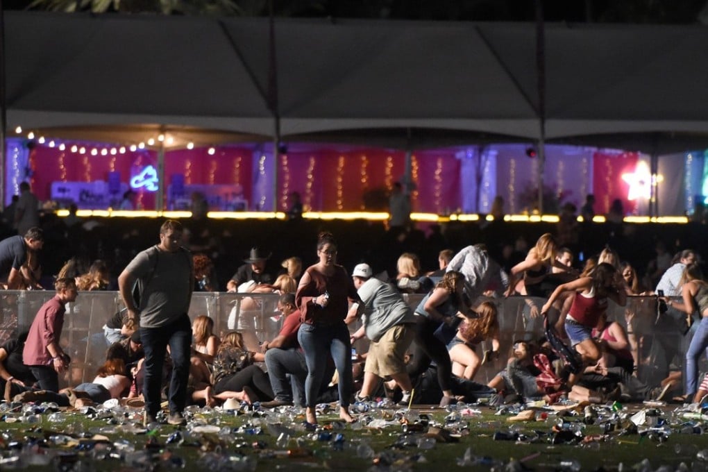 People run from the Route 91 Harvest country music festival after gunfire was heard on October 1, 2017 in Las Vegas, Nevada. Photo: Getty Images/ AFP