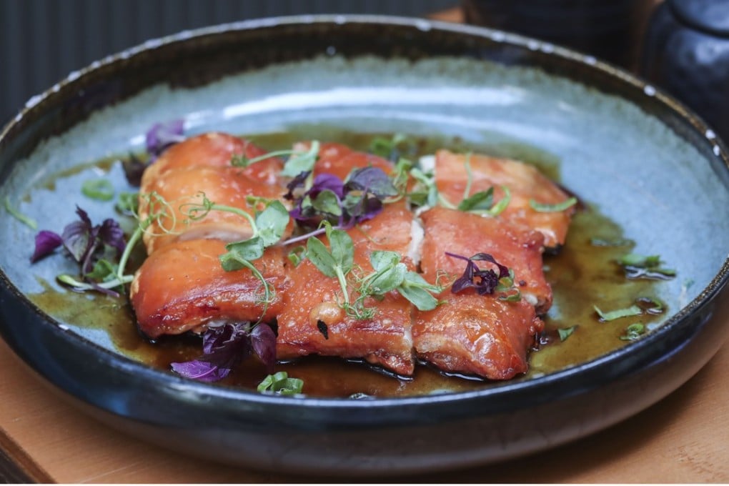Suckling pig with pork jus and black vinegar reduction at Chifa Dumpling House in Central. Photo: Jonathan Wong
