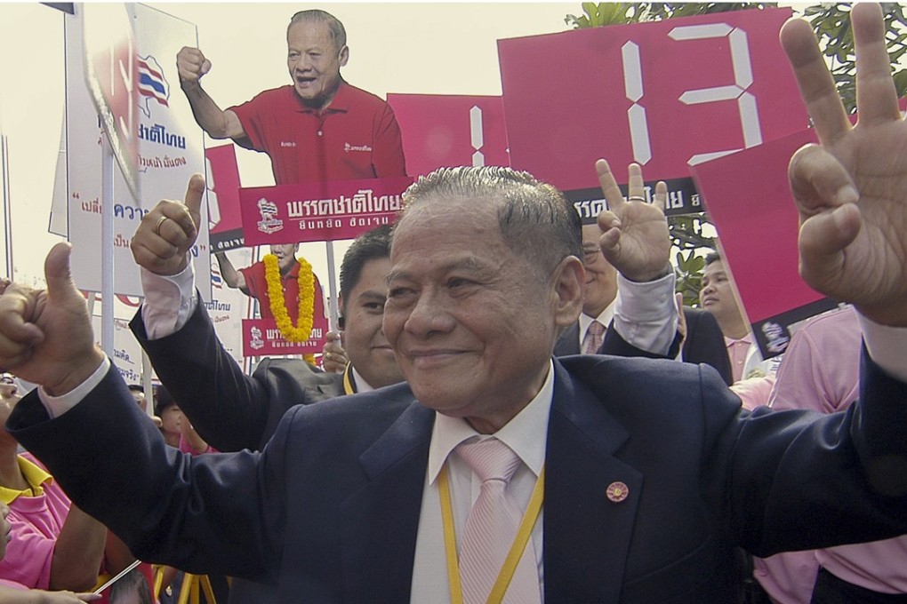Former premier Banharn Silpa-archa acknowledges his supporters after registering as a candidate for the general election in Bangkok, Thailand, in 2007. Photo: AFP