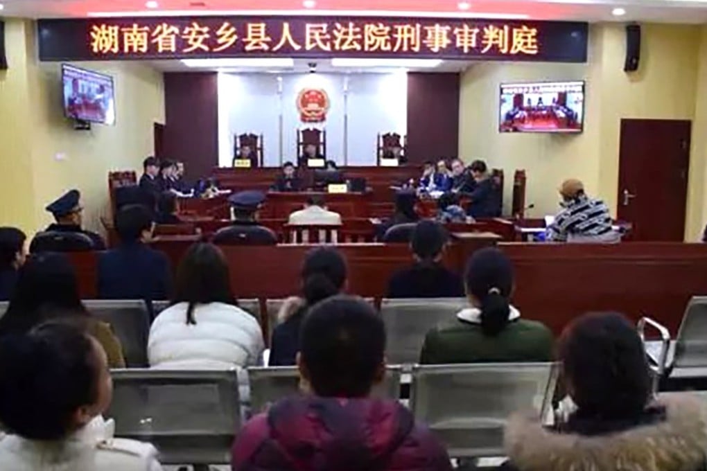 A court hearing in Hunan Province, China. A businessman there was reportedly sentenced to four years in prison and fined 30,000 yuan after he hired detectives to photograph local judges engaged in illegal activities. Photo: Handout
