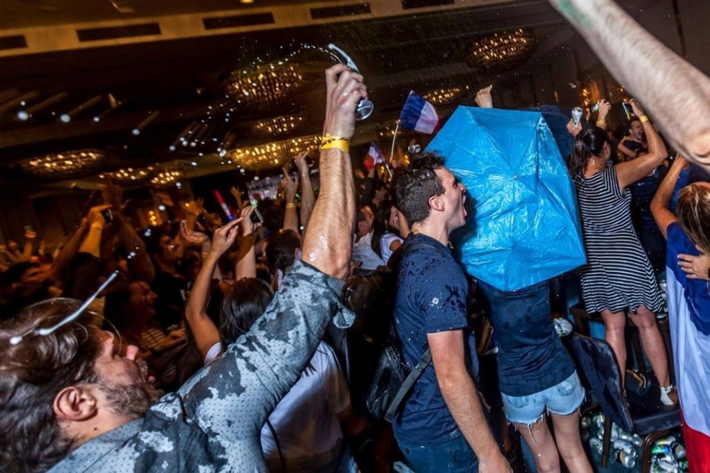 Fans celebrate in the French ‘fan zone’ organised by the UFE at the Kerry Hotel in Hung Hom. Photo: UFE