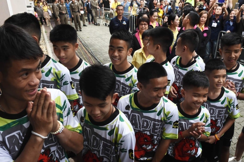 The 12 boys and their coach. Photo: AFP