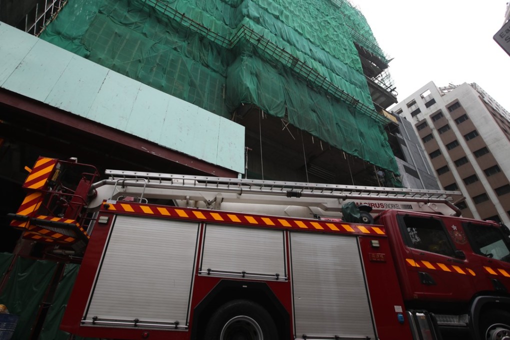A fire engine arrives at the site on Middle Road. Photo: Edward Wong