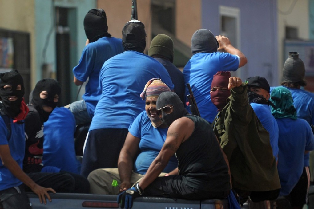 Paramilitaries on a truck in Masaya, following clashes with anti-government demonstrators. Photo: AFP