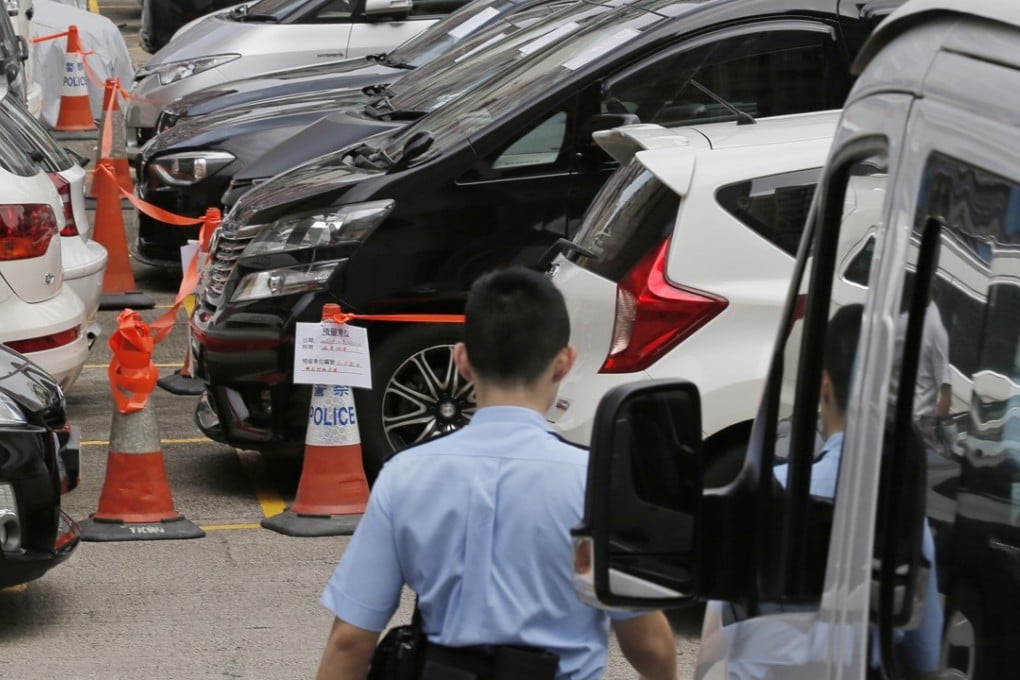 Impounded vehicles parked at a police station in Hong Kong, after a crackdown on Uber services, in May 2017. Photo: AP