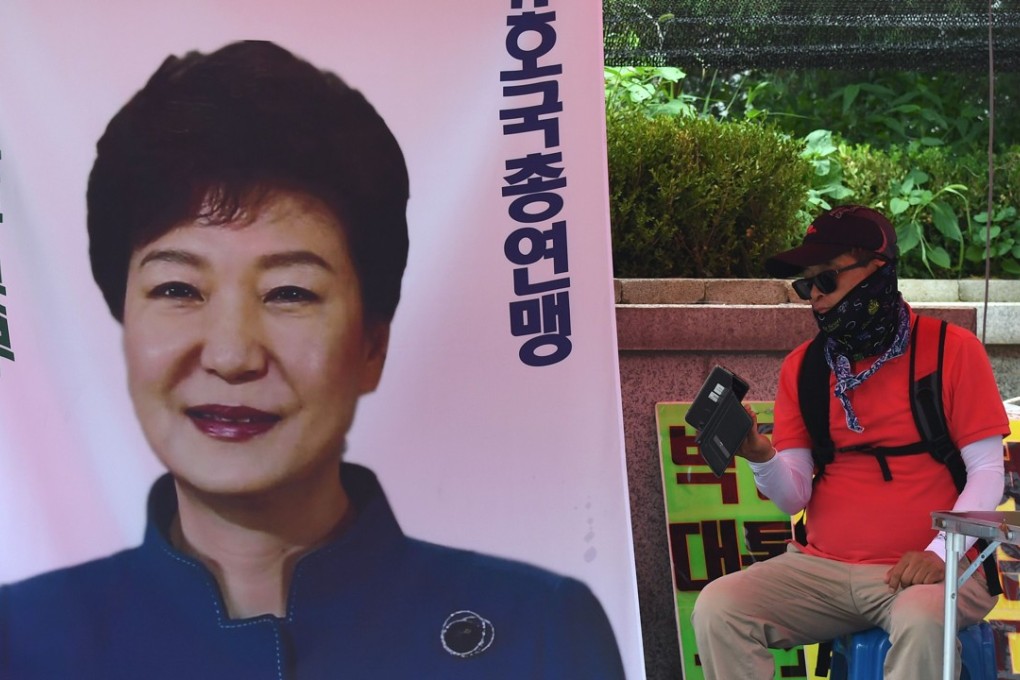 A supporter of South Korea’s former president Park Geun-hye at a protest demanding her release outside Seoul Central District Court on July 20, 2018. Photo: AFP
