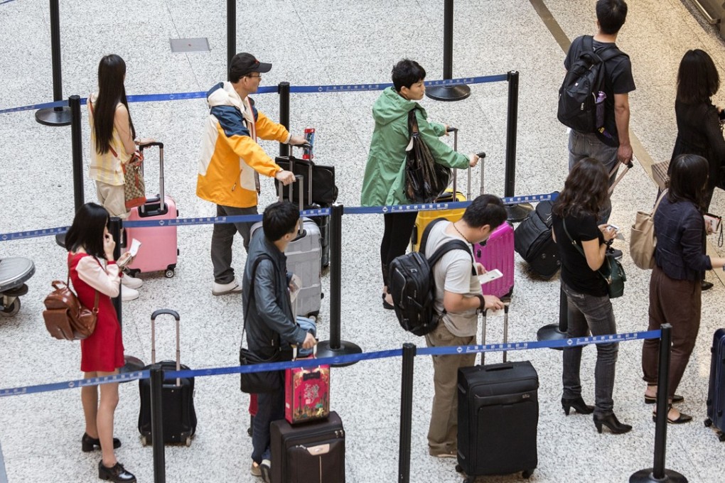 Chinese travellers are forecast to make more than 200 million outbound trips annually by 2020, up from about 130 million outbound trips last year, according to estimates from the China National Tourism Administration. Photo: Bloomberg