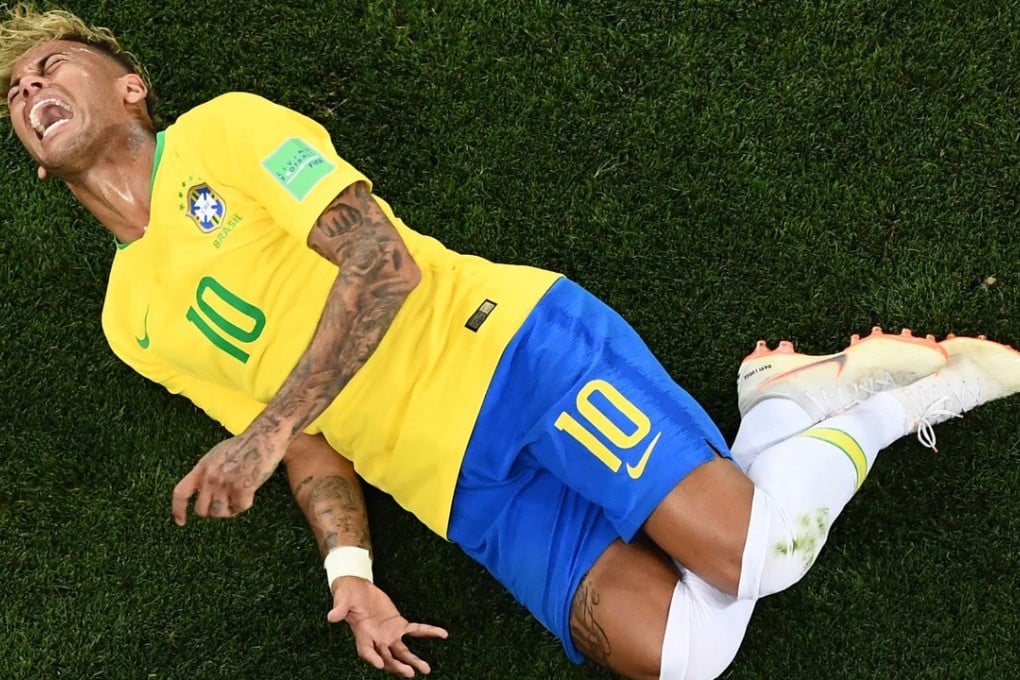 Neymar reacts after being tackled by Switzerland midfielder Valon Behrami during the World Cup. Photo: AFP