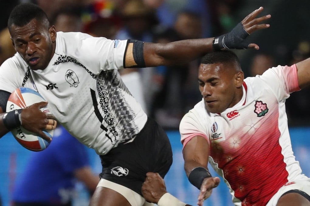 Sevuloni Mocenacagi (left) of Fiji in action against Jose Coyickal Seru (right) of Japan during the Rugby World Cup Sevens in San Francisco. Photo: EPA