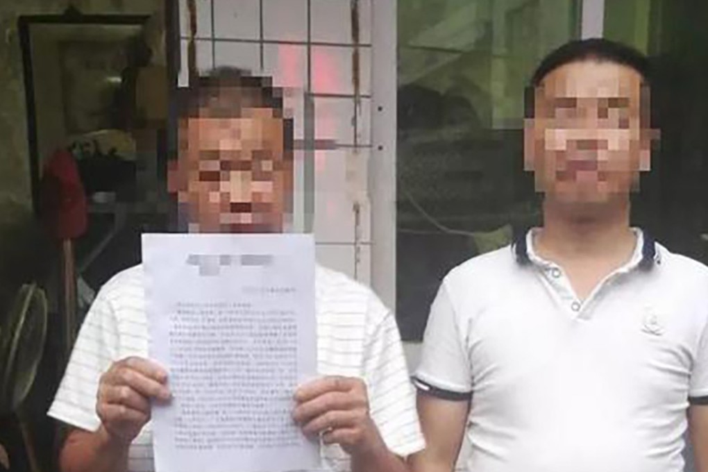 Zhang Jun (right), pictured with his father, was paid US$130,000 in compensation after spending eight years in prison for a crime he did not commit. Photo: Sina