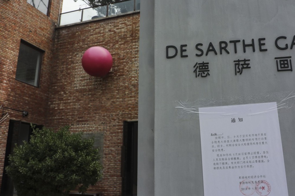 A notice of demolition is posted at the entrance of the de Sarthe Gallery in Beijing's Caochangdi art district. Galleries have been given two weeks to move out. Photo: Simon Song
