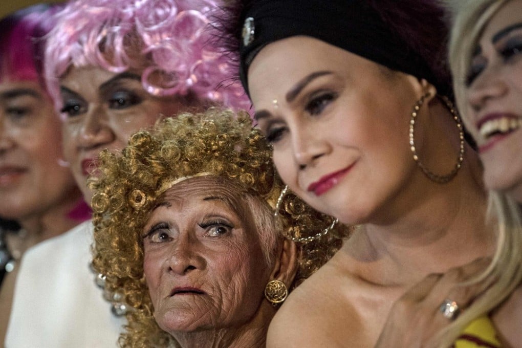 Al Enriquez (lower centre), also known as “Carmen Dela Rue”, and other contestants taking part in the Golden Gays of Manila Beauty Pageant. Photo: AFP