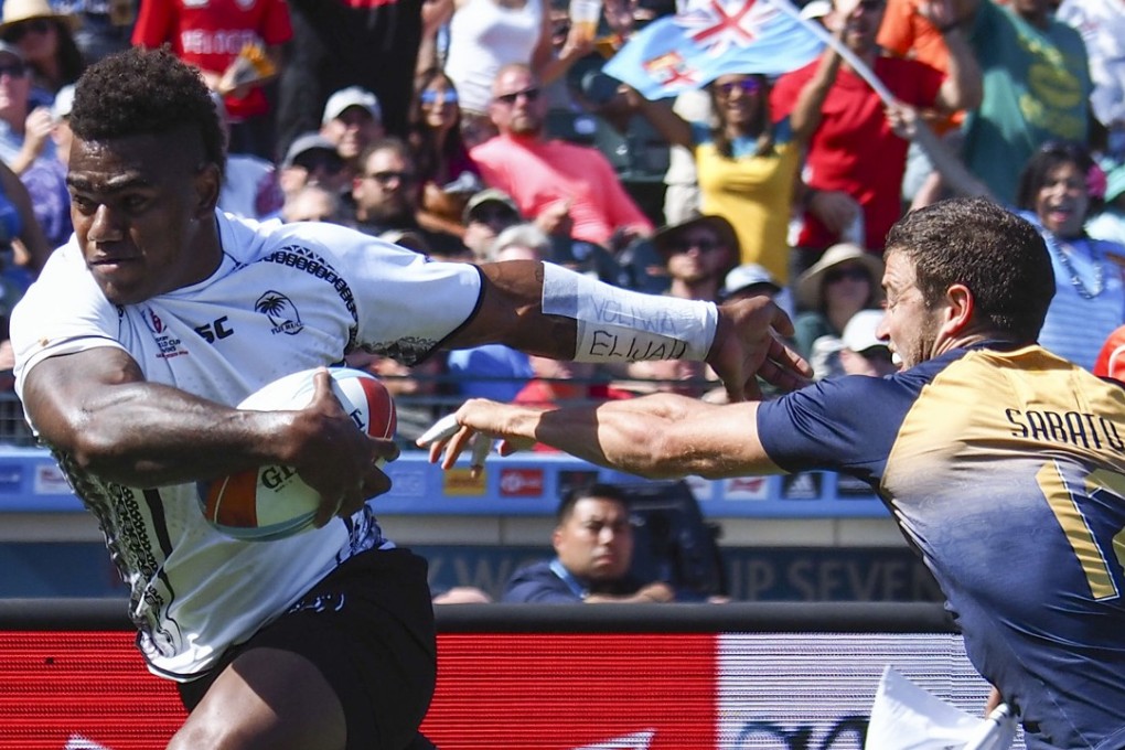 Josua Tuisova runs against Argentina’s Franco Sabato in the Rugby World Cup Sevens at AT&T Park. Photo: USA TODAY Sports