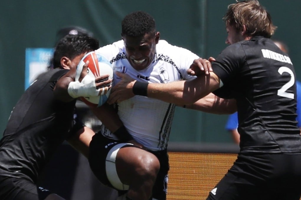 Fiji’s Kalione Nasoko is swamped by New Zealand’s Dylan Collier (left) and Tim Mikkelson. Photo: EPA
