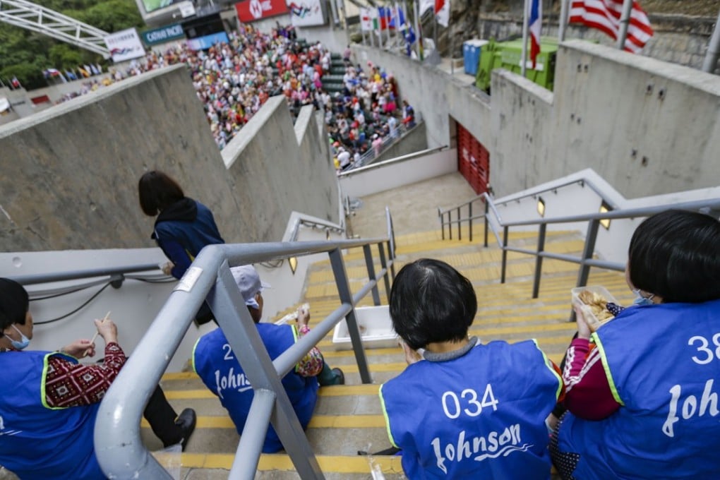 Cleaners take a break during the second day of the Hong Kong Sevens. Unions are calling for an increase in the city’s minimum wage. Photo: May James