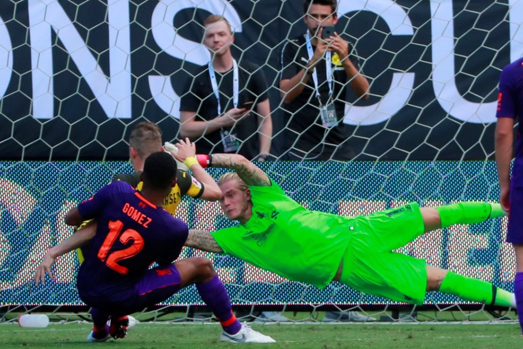 Jacob Bruun Larsen scores past Liverpool’s Loris Karius. Photo: Reuters