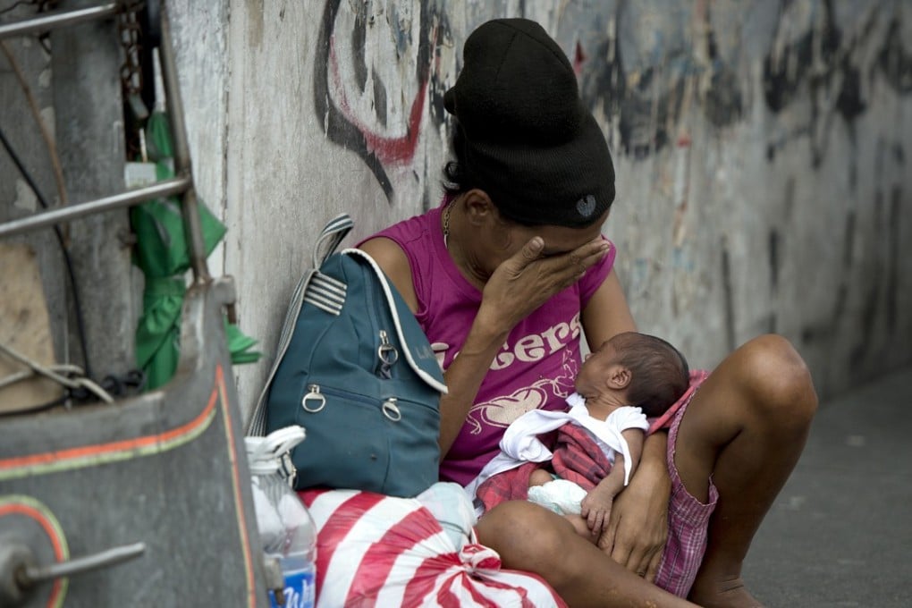 A homeless woman and her baby in Manila, in the Philippines, where abortion is illegal. Routinely vilified in the Western media, President Rodrigo Duterte opposes the powerful Catholic Church on, among other issues, contraception. Picture: AFP