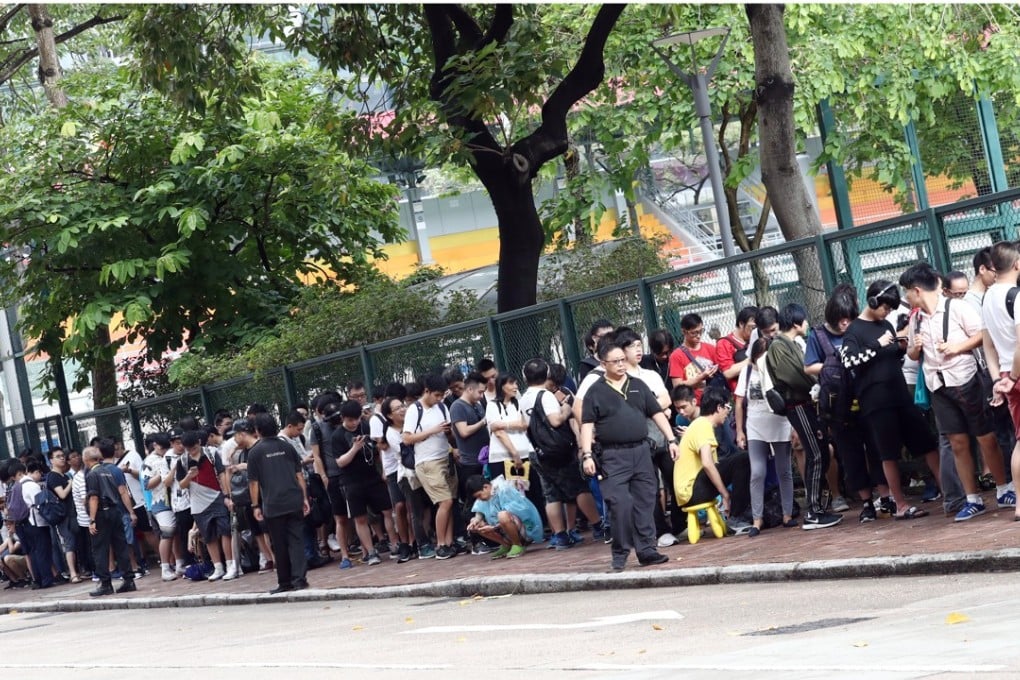More than 300 people queue outside MacPherson Stadium in Mong Kok, hoping to get early bird tickets for the Animation, Comics, and Games Expo. Photo: Nora Tam
