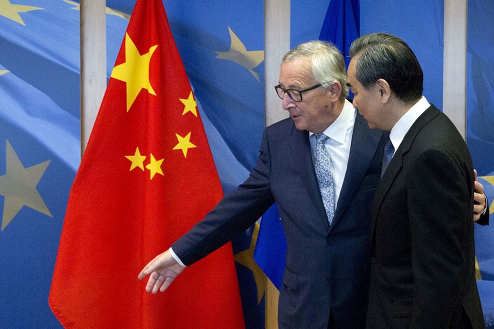 European Commission President Jean-Claude Juncker, left, greets China's Foreign Minister Wang Yi prior to a meeting at EU headquarters on June 1. Beijing and Brussels are effectively writing the rules that may determine the future of the internet. File photo: AP