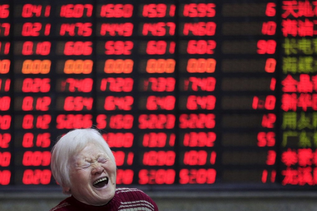 An investor in front of an electronic board in Shanghai on March 7, 2016. Contrary to global conventions, China’s stock exchanges denote gains and advances in red, and uses the green colour to represent declines and losses. Photo: REUTERS/Aly Song/File Photo