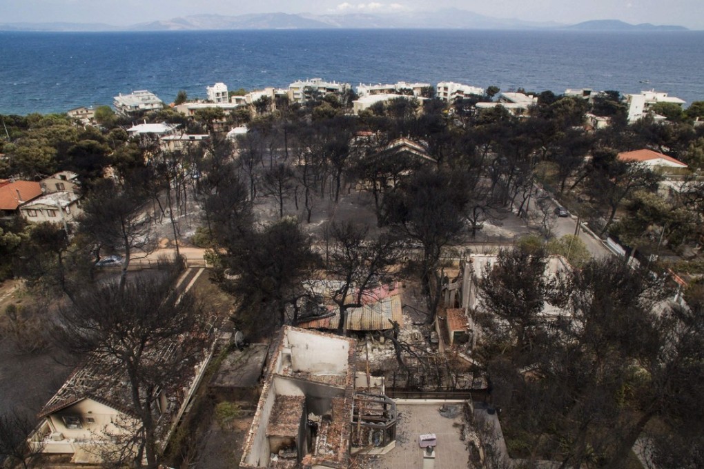 An aerial view shows burnt houses following a wildfire that destroyed the Greek village of Mati. Photo: Agence France-Presse