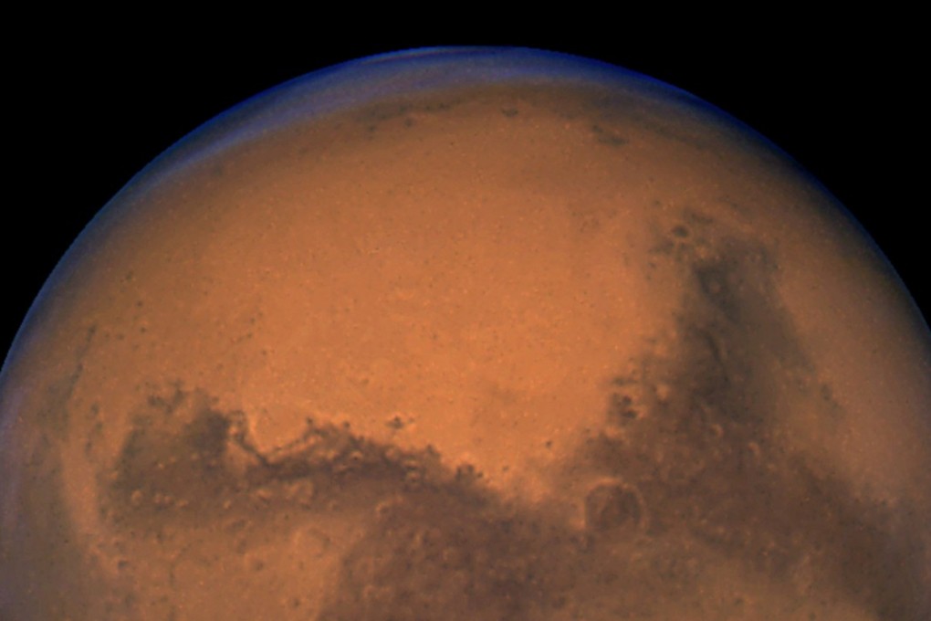 Hubble Space Telescope took this snapshot of Mars 11 hours before the planet made its closest approach to Earth. Photo: Reuters